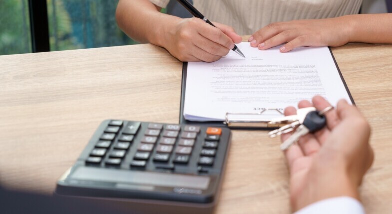 Borrower and lender reviewing loan documents together